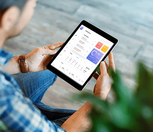Person viewing the Lentra co-lending dashboard on a tablet
